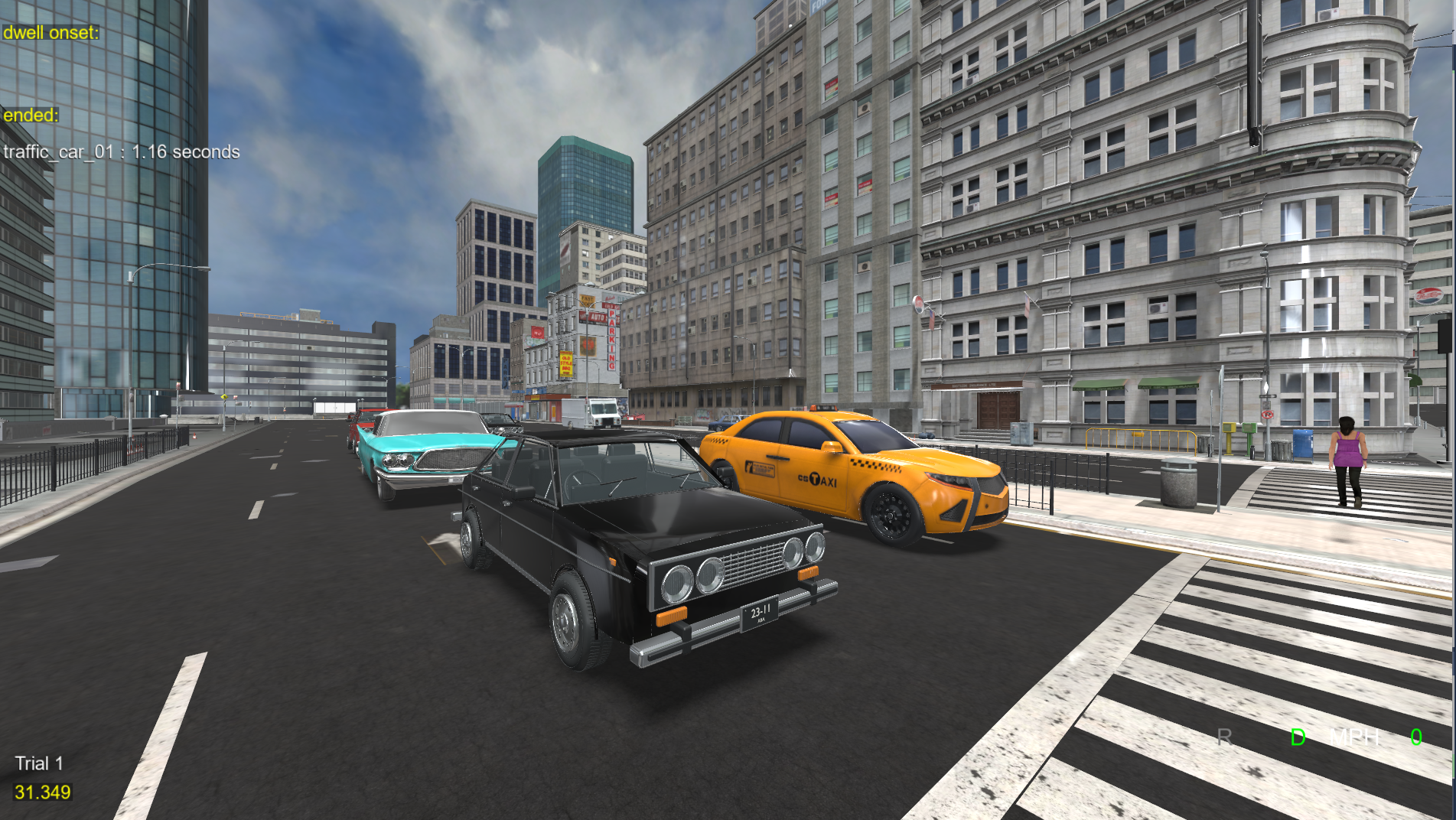 Traffic vehicle models, including a black sedan and a taxi, stopped at a crosswalk