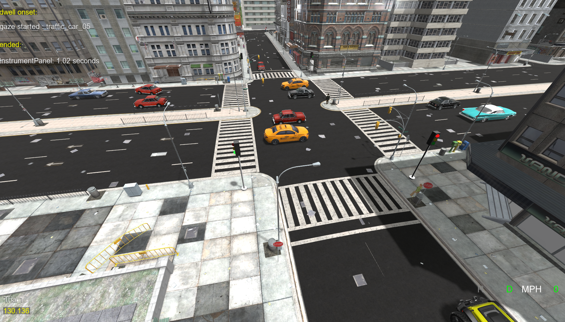 Traffic vehicles and traffic lights at a city intersection, seen from above